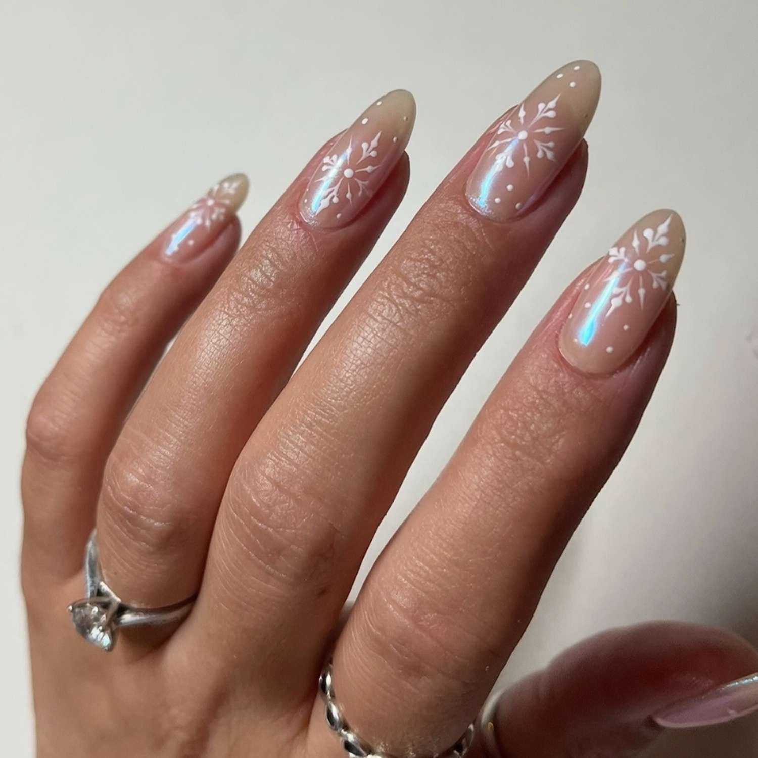 Sheer Nude Snowflake Almond Nails Sheer Nude Snowflake Almond Nails — Christmas Nail Colors 2026