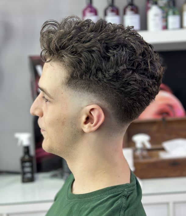 Short Taper Fade With Textured Curls — Winter Haircuts for Men
