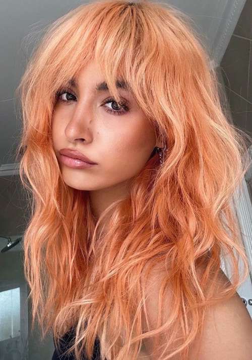 Peach Blonde Shag With Bangs Peach Blonde Shag With Bangs — Winter Hair Colors