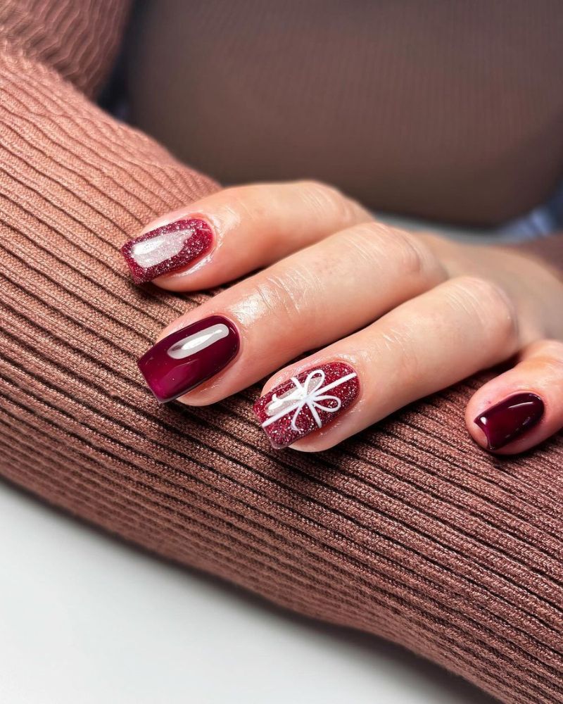 Short Burgundy with Glitter Bow Accent Short Burgundy with Glitter Bow Accent — Burgundy Christmas Nails 2026