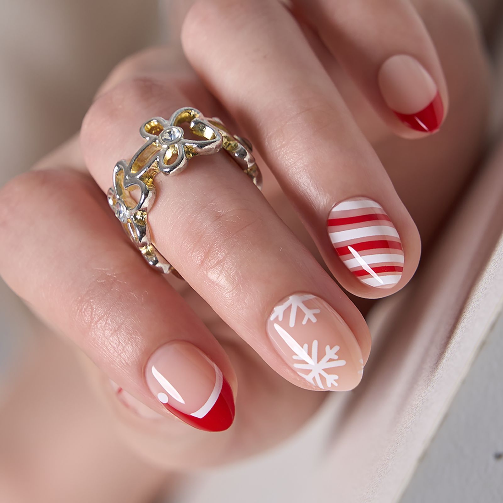 Sheer Pink with Candy Cane French Almonds Sheer Pink with Candy Cane French Almonds — Short Christmas Almond Nails 2026