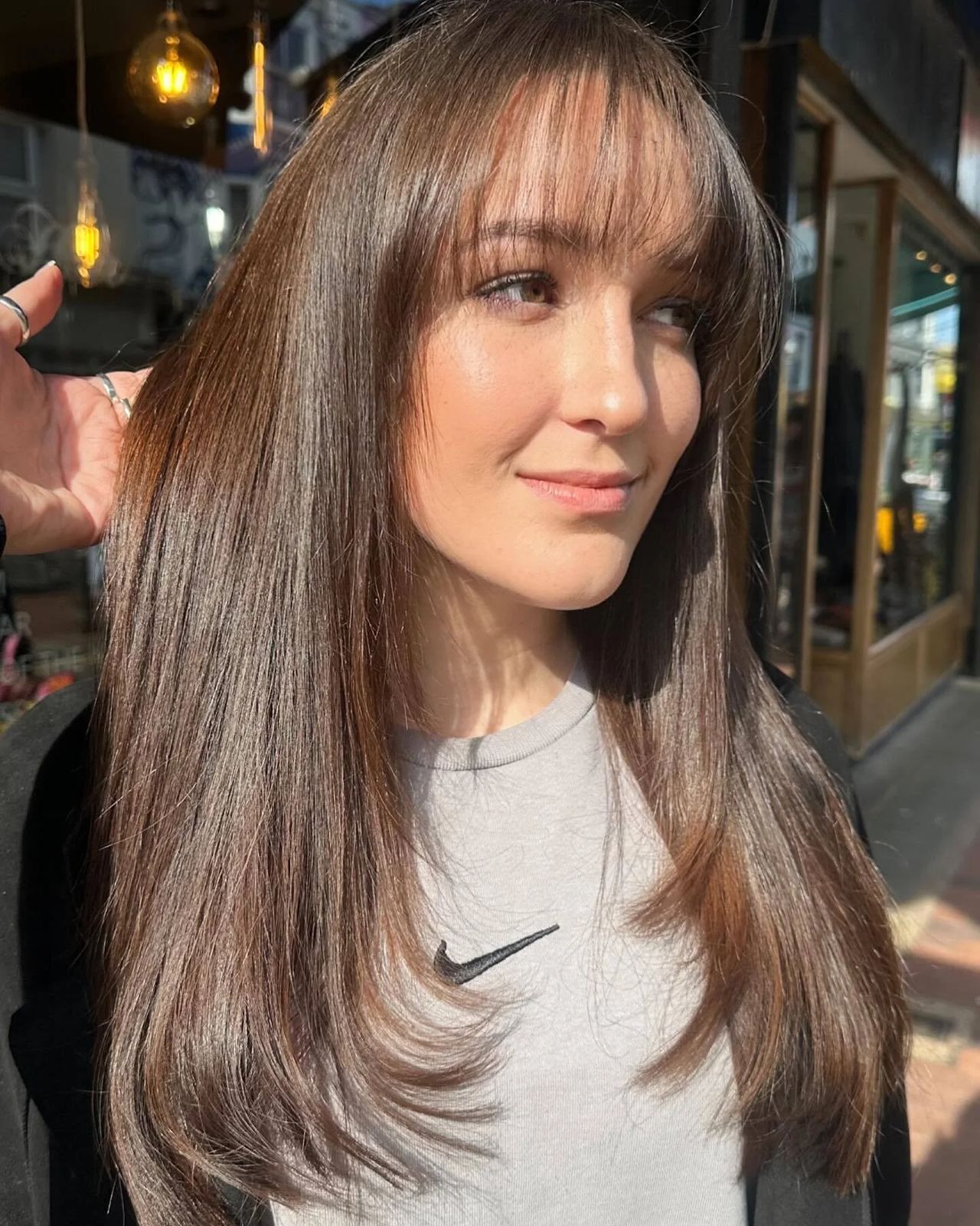 Mid-Back Dark Brown Blowout With Side Swept Bangs Mid-Back Dark Brown Blowout With Side Swept Bangs — Winter Hairstyles for Long Hair