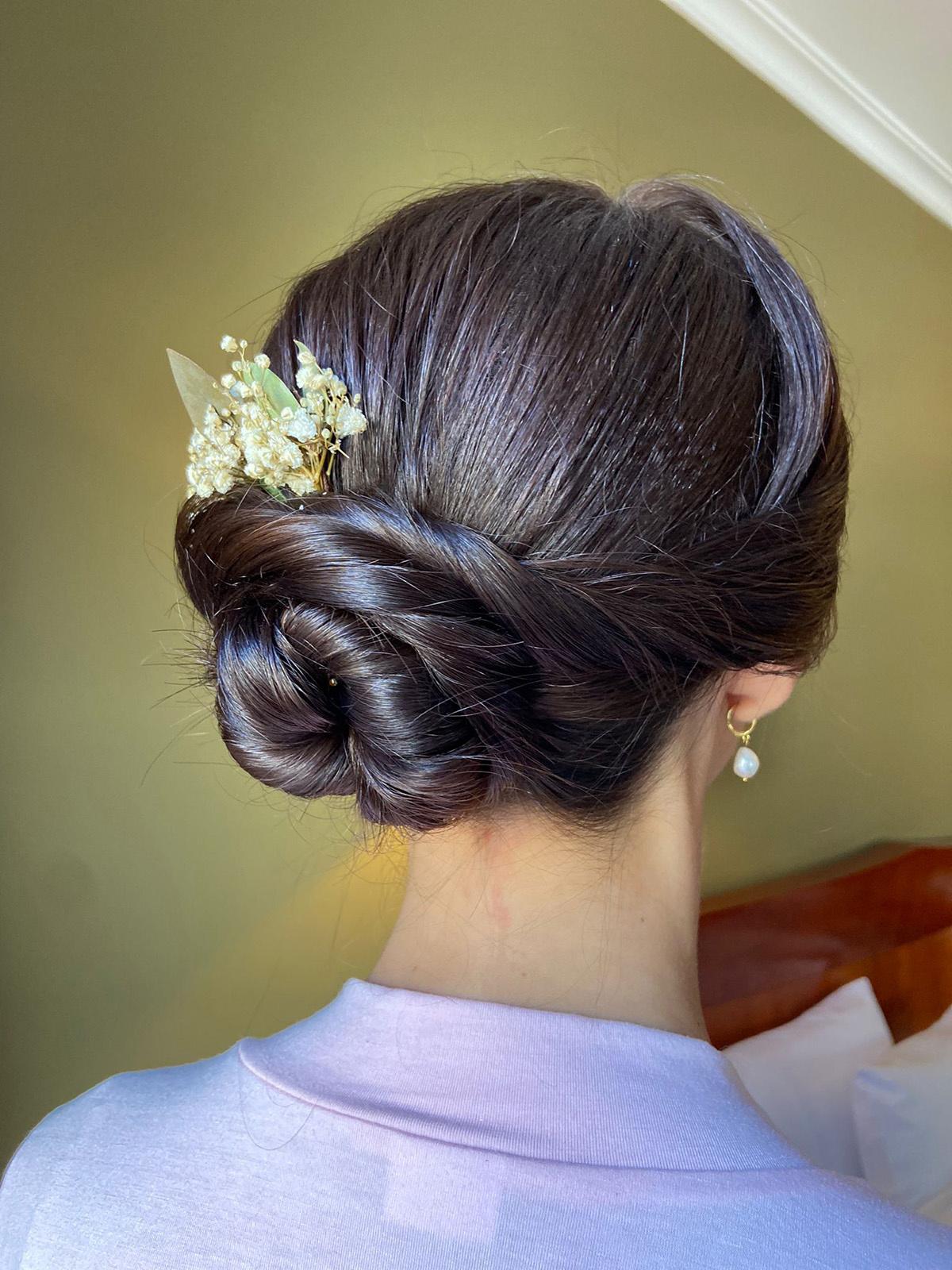 Braided Bun With Floral Accessory Braided Bun With Floral Accessory — Winter Natural Hairstyles