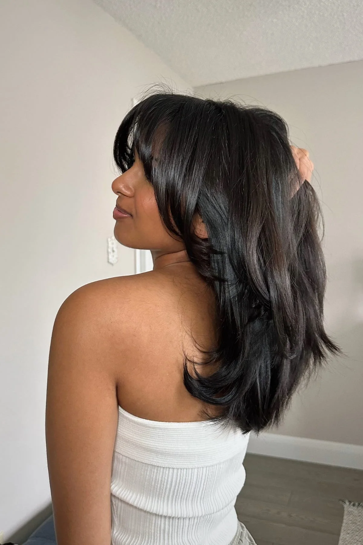 Voluminous Layered Cut With Full Bangs — Winter Hairstyles for Work