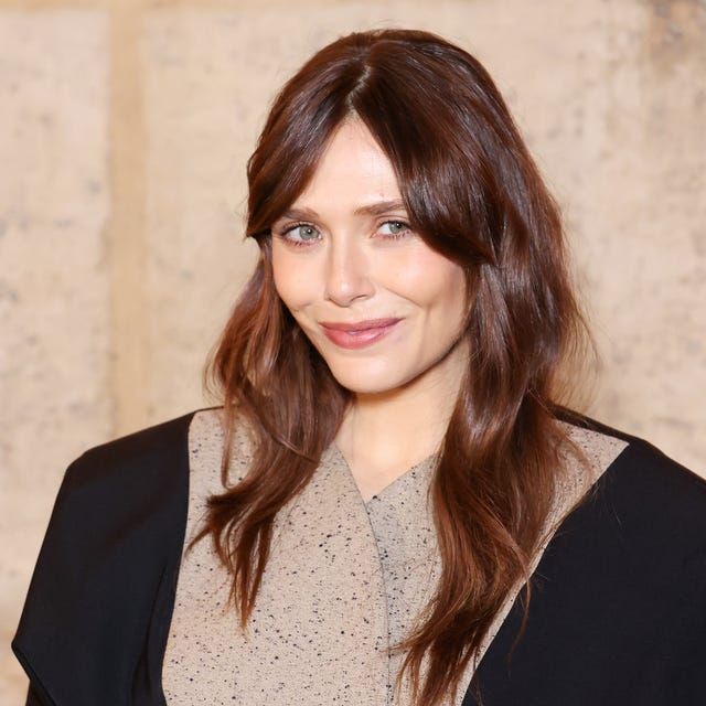 Mid-Back Layers With Side-Swept Bangs — Winter Haircuts for Oval Faces