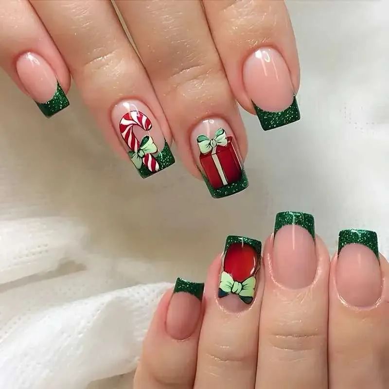 Sheer Pink Green Glitter Tips With Motifs Sheer Pink Green Glitter Tips With Motifs — Short Christmas Coffin Nails 2026