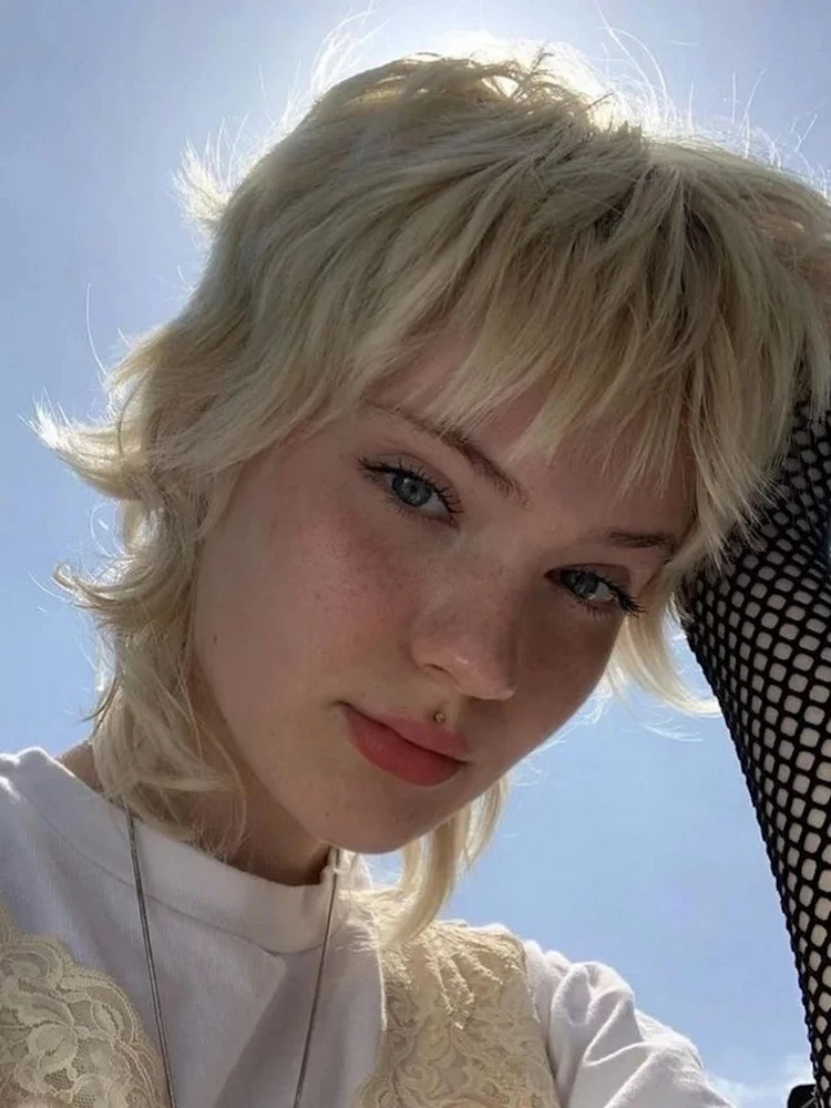 Edgy Textured Pixie With Side-Swept Bangs Edgy Textured Pixie With Side-Swept Bangs — Winter Hairstyles for Thick Hair